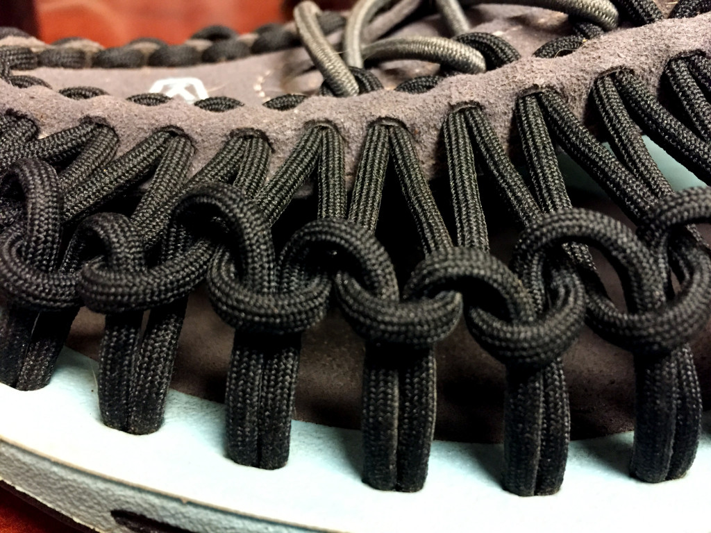 Upper shoe, laced and knotted paracord. 